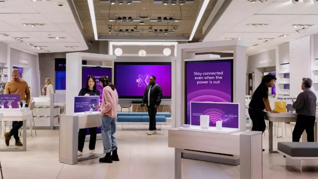 Shoppers and Staff Inside an Xfinity Store - Is Xfinity Open on Labor Day?