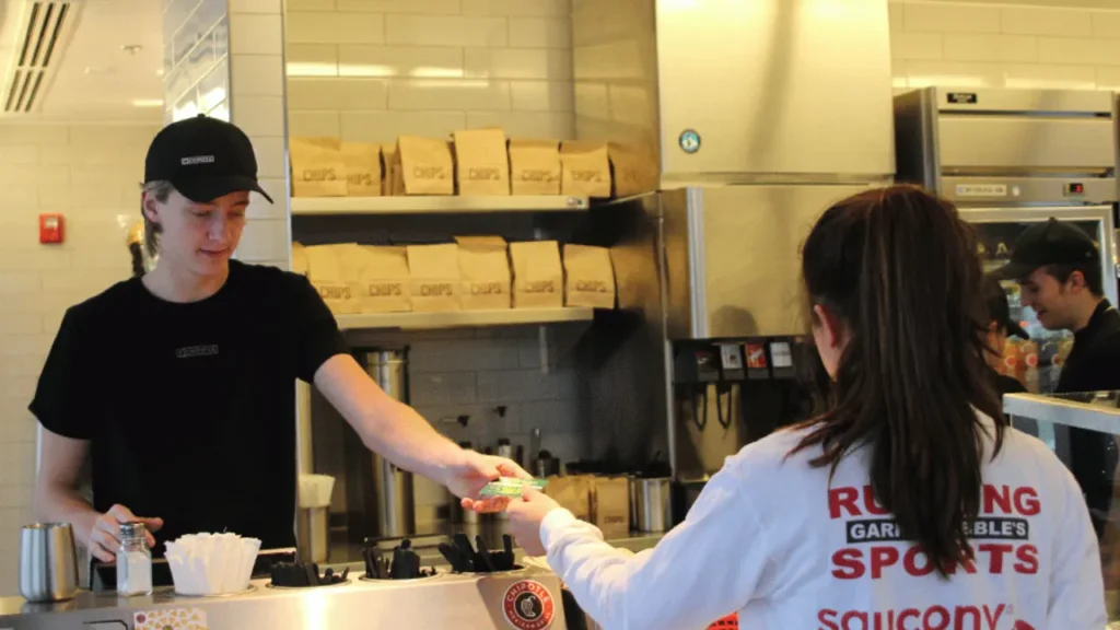 Chiptole Counter Customer Paying Bill With Card - Chipotle Store Hours