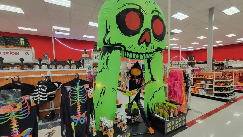 An Inflatable Green Skeleton Archway in A Target Store Aisle Decorated for Halloween - Is Target Open On Halloween?
