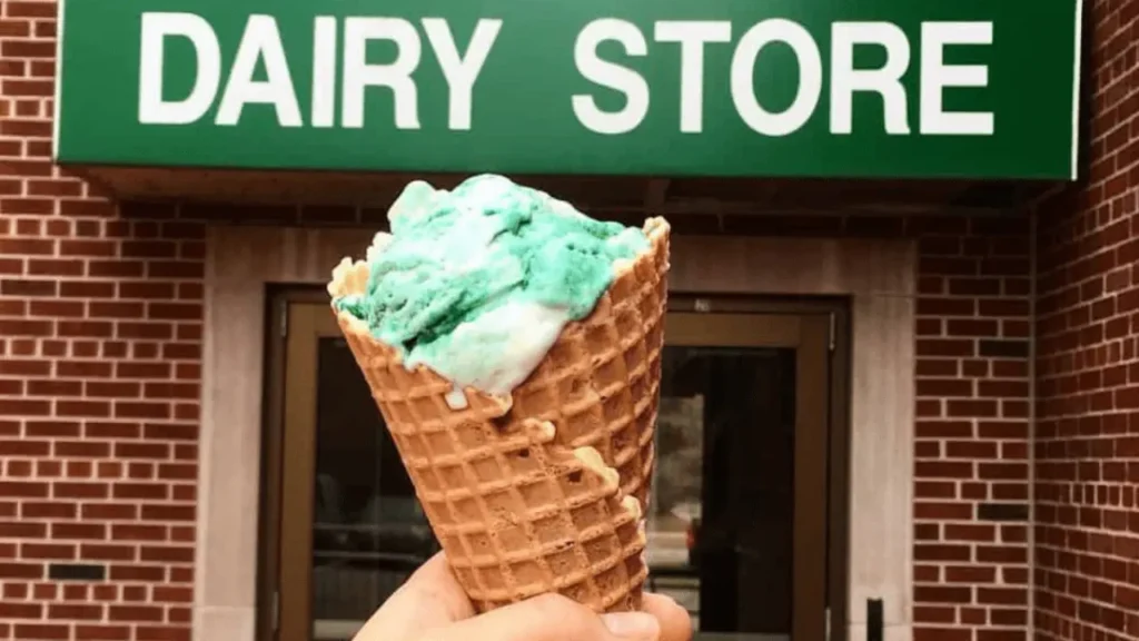 Hand Holding an Ice Cream Cone in Front Of MSU Dairy Store - MSU Dairy Store Hours