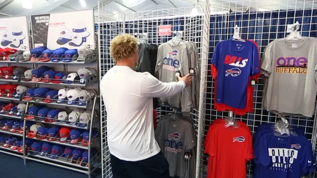 Man Browsing Apparel in Buffalo Bills Store - Buffalo Bills Store Hours