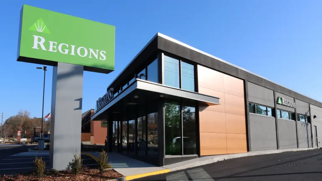 Exterior View of A Regions Bank Building with A Large Green Monument Sign - Regions Bank Hours